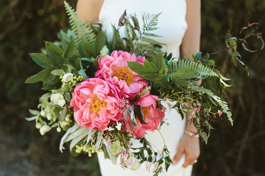 A gorgeous bridal bouquet with large pink peonies
