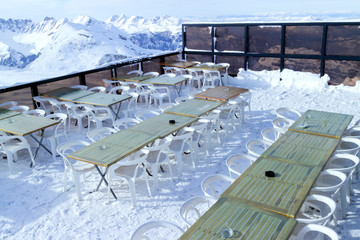 Apres ski restaurant at the top of mountain with panoramic views of alpine peaks, Alps, France ,