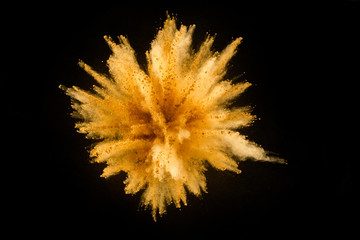 Colored powder explosion on black background