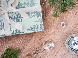 Christmas composition. Christmas gifts, fir tree branches, black and golden decorations on white background. Flat lay, top view, copy space