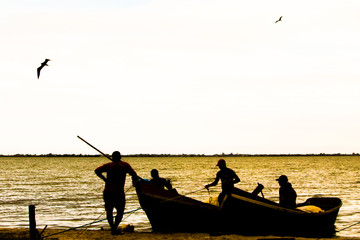 silhouette of a fisherman