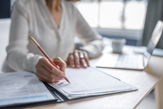 Businesswoman Writing at Work
