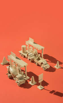 Gas/pump station miniature with truck/lorry and heavy machinery.
