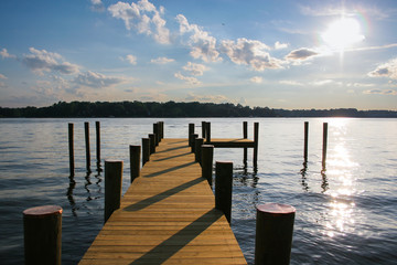 wood dock pier sunset river lake
