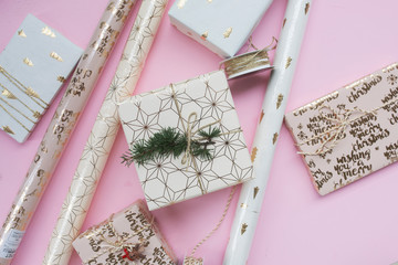 Christmas gifts on a pink background