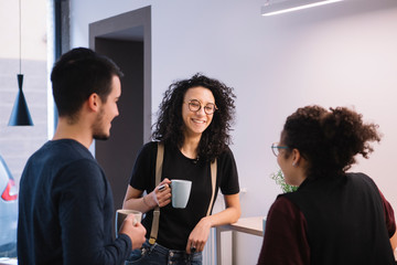 Colleagues chatting in office