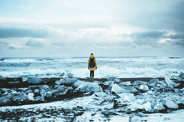Girl on Diamond Beach in Iceland - obrazy, fototapety, plakaty