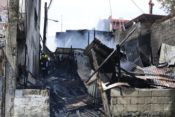 burnt and gutted houses of fallen interior shanty houses