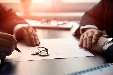 Real estate agent signing a contract buy-sell home