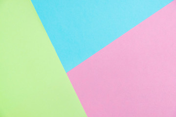 Pastel colored paper flat lay top view, background texture, pink, purple, yellow, beige, green and blue.