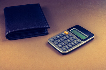 Calculator and wallet as finance concept