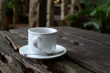 Cup Of Black Coffee on dead wood table