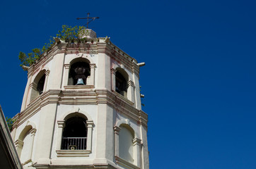 Fototapeta premium San Pablo City, Laguna, Philippines - December 3, 2016: Old Church tower under blue sky