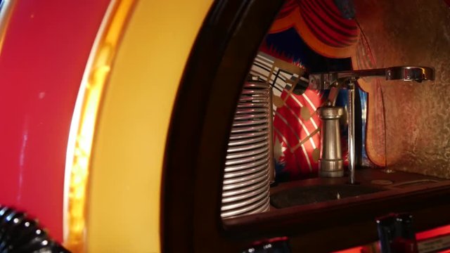 Close-up look inside an antique record playing jukebox