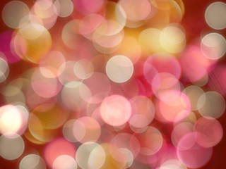 Bright coloured yellow and pink round blurred lights on a glowing red background