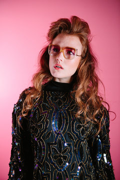 1980's Studio Portrait Of A Redheaded Woman With Curly Hair In Era Specific Beaded And Sequin Top With Shoulder Pads.