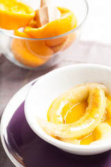 Fried bananas in orange sauce, a delicious dessert from fruits, butter and cognac.