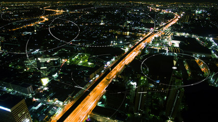 Futuristic digital broadcasting, gps location signals and data connectivity in the cityscape at night time