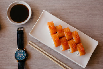 Philadelphia roll sushi cucumber, avocado, cream cheese, red caviar. Sushi menu