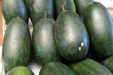 fresh water melon fruit symmetrically to attrack buyers at market stall