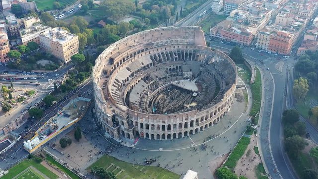 Aerial view of Colosseum in Rome, famous ancient Rome amphitheatre - landscape panorama of Italy from above, Europe