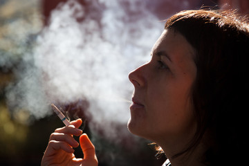 woman smoking a cigarette - anti smoking campaign
