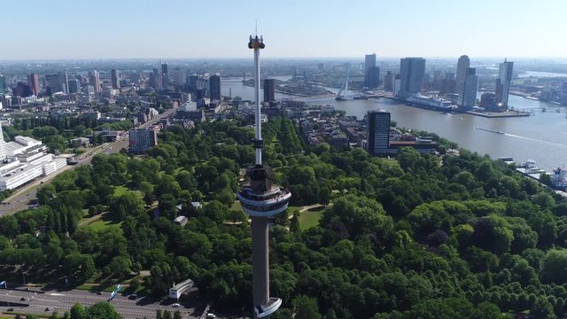Aerial footage of Euromast popular tourist attraction in Rotterdam the second largest city in Netherlands in South Holland also showing Erasmusbridge and Noordereiland in background 4k quality
