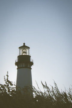 Yaquina Head Lighthouse in Newport Oregon, along the Pacific Ocean coastline. Filter applied to photo