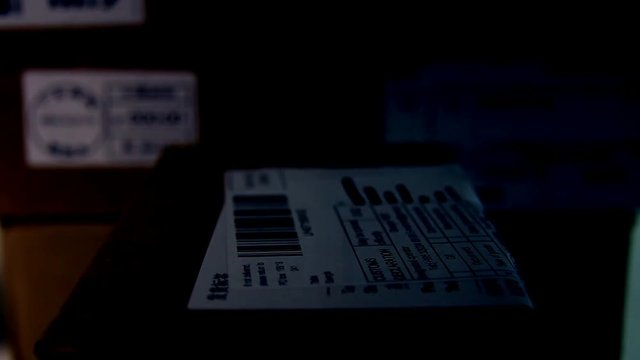 Close Up Of Parcel Package In The Dark.