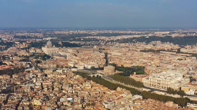 Aerial view of Rome, Castel Sant'Angelo (Castle of the Holy Angel) in foreground and Vatican City in background, bridges over river Tiber - cityscape of capital city of Italy from above, Europe
