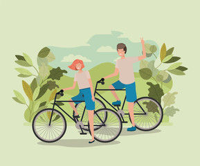 young couple on bicycle in the park