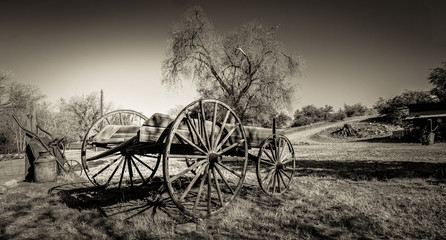 Fototapeta na wymiar Rustic Wagon in Field - Sepia