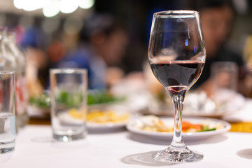 Wine glasses and party at the night of the celebration.