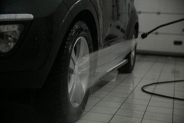 Car washing. Cleaning Car Using High Pressure Water.