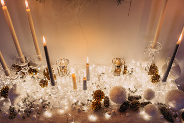 Christmas decoration of candles, lights, chrisms balls put in a set