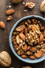 Almond and walnut on wooden background