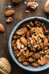 Almond and walnut on wooden background
