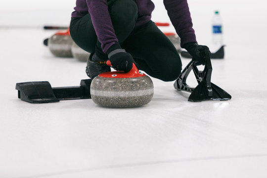 Curling: Woman Ready To Push Off From Hack