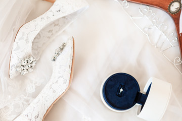 Wedding dresses, wedding shoes, rings, all white