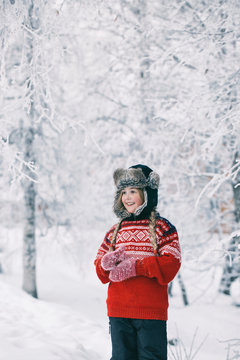 Outdoor Winter Portrait of Cute Norwegian Girl Standing Among Wh