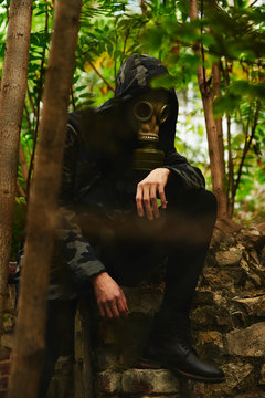 Man with gasmask on some ruins