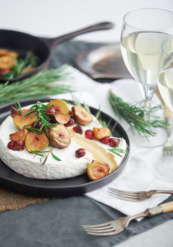 Baked brie with figs,cranberries and rosemary.