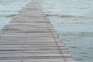 Obraz premium Abstract texture and background of wooden walkway into the sea