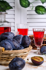 Fresh purple plums with water drops