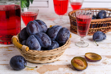 Fresh purple plums with water drops