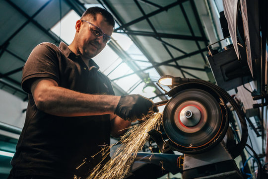 Mechanic working in the motorbike workshop
