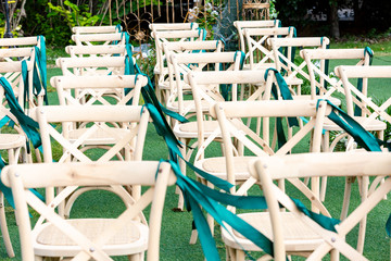 No one's outdoor wedding scene, green plants and neatly arranged chairs