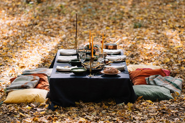Outdoor dining setup, Table setting for the dinner party in the forest