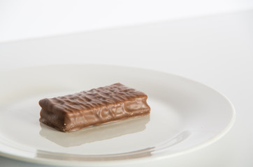 Chocolate biscuit on a white plate