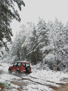 Jeep Driving In Snowy Woods